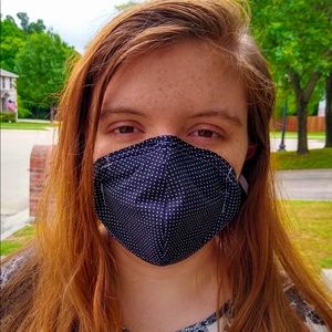 Face mask with filter pocket and nose piece